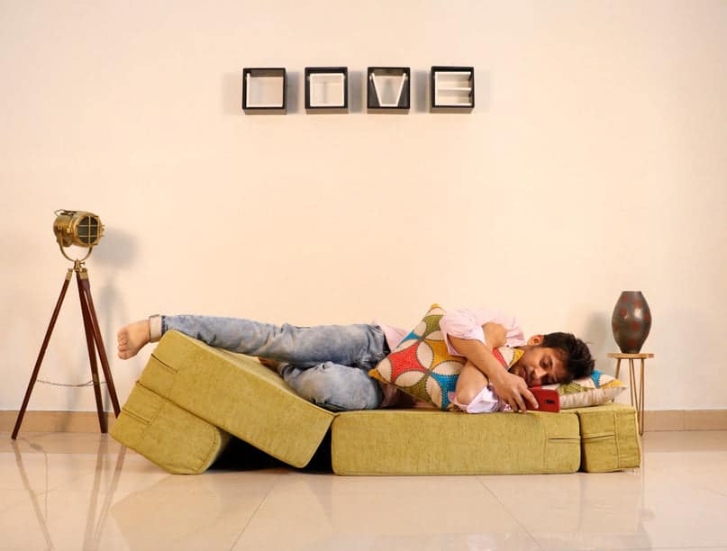 sofa cum bed used as a lounger actual image or real lifestyle image
